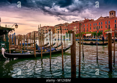 VENICE, ITALY - MAY 20, 2017: Beautiful view from the gondola stand (docks) on the Grand Canal on a cloudy afternoon in Venice, Italy. Stock Photo
