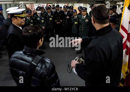 YOKOSUKA, Japan (Jan. 23, 2018) Lt. Cmdr. Dave Levy, public affairs officer of the Navy's forward-deployed aircraft carrier, USS Ronald Reagan (CVN 76), gives a tour of the ceremonial quarterdeck to Joint Staff College students. Ronald Reagan, the flagship of Carrier Strike Group 5, provides a combat-ready force that protects and defends the collective maritime interests of its allies and partners in the Indo-Asia-Pacific region.  (U.S. Navy Stock Photo