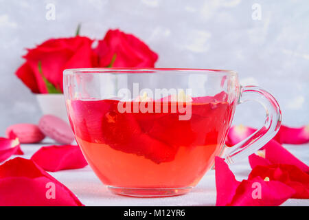 tea made from tea rose petals in a glass bowl on grey table Stock Photo