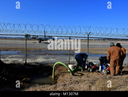 Water and fuels system maintainers from the 51st Civil Engineer Squadron setup a water pump at Osan Air Base, Republic of Korea, Jan. 24, 2018. Members from the 51st CES had to repair an underground water line that was damaged due to cold weather. (U.S. Air Force Stock Photo