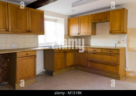 An empty kitchen in a vacant house Stock Photo