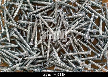 Full frame close up of plated cross head wood screws Stock Photo