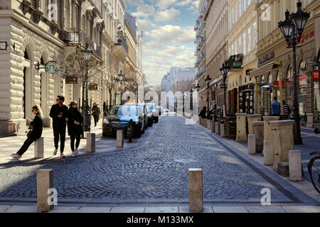 Spring view of Hercegprímás street in Budapest with walking travelers Stock Photo