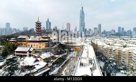 Nanjing. 26th Jan, 2018. Photo taken on Jan. 26, 2018 shows snow scenery of Jiming Temple and ancient city wall in Nanjing, east China's Jiangsu Province. Credit: Han Yuqing/Xinhua/Alamy Live News Stock Photo