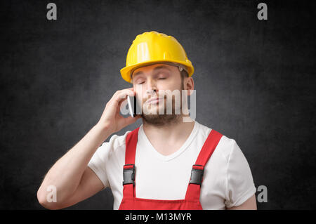 Construction worker using smartphone Stock Photo