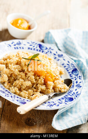 Austrian crumble dessert with fruit puree Stock Photo