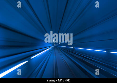 Speed blurred motion of train or subway train moving inside tunnel. Stock Photo