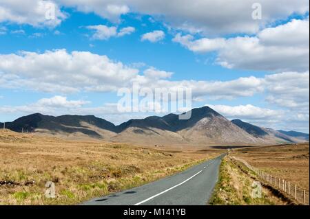 Ireland, County Galway, Connemara National Park, Maumturk Road and Mountains Stock Photo