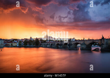 Fantastic natural phenomena summer storm over Charles bridge, Prague castle and Vltava river in Prague, Czech Republic Stock Photo