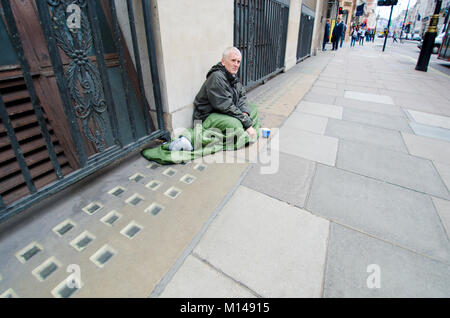 London, England, UK. Homeless man man sleeping rough in central London Stock Photo