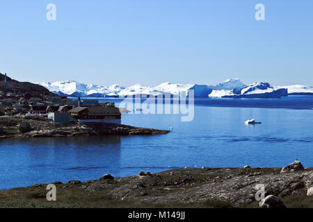Icebergs float in the water near the town Ilulissat formerly Jakobshavn or Jacobshaven, Western Greenland Stock Photo