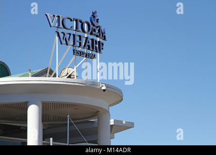 Victoria Wharf Sign on a balcony against blue sky at the Vicoria Wharf Shopping Centre (Established in 1992), V&A Waterfront, Cape Town, Westertn Cape Stock Photo