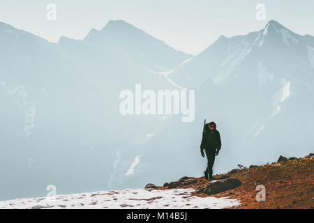 Active Man hiking alone in mountains Lifestyle travel survival concept adventure outdoor active vacations climbing sport wild nature Stock Photo