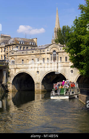 Bath, UK - 3rd July 2011: A trip boat full of sightseers near historic Pulteney Bridge on the River Avon, Bath, UK. Bath is a UNESCO World Heritage Site famous for it's architecture. Stock Photo