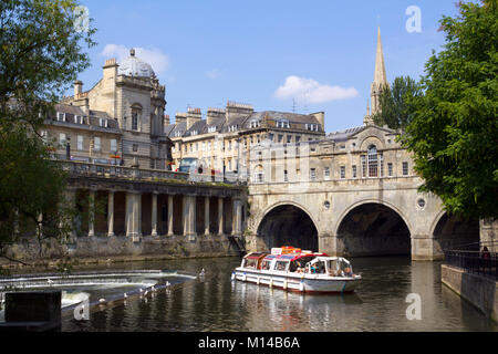 Bath, UK - 3rd July 2011: A trip boat full of sightseers near historic Pulteney Bridge on the River Avon, Bath, UK. Bath is a UNESCO World Heritage Site famous for it's architecture. Stock Photo