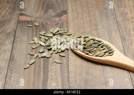 Download Peeled Pumpkin Seeds In Wooden Bowl Isolated On White Background Stock Photo Alamy Yellowimages Mockups