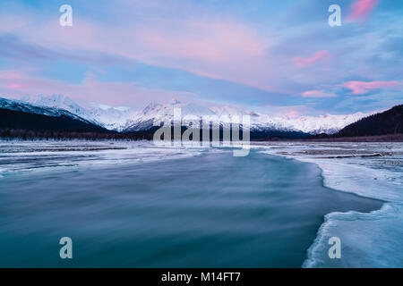 Alpenglow and long exposure of Klehini River in the Chilkat Bald Eagle Preserve near Haines in Southeast Alaska. Stock Photo