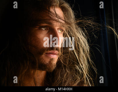 Handsome man with long hair Stock Photo