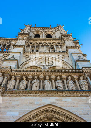 Paris, France: Sculptures on the Portal of  St. Anne on the western facade, southern tower, of Notre Dame Cathedral. Stock Photo