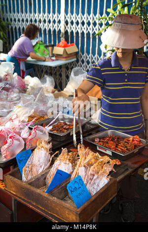 Asian street vendors at the market selling selection of the local seafood, meat and vegetables, Melacca, Melaka, Jonker Street market, Malaysia Stock Photo