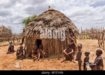 Ethiopia, Lower Omo Valley listed as World Heritage by UNESCO, Hamer tribe, Women wear skirts and baby carriers made of goatskin adorned with coris and they coat their hair with butter mixed with ocher red Stock Photo