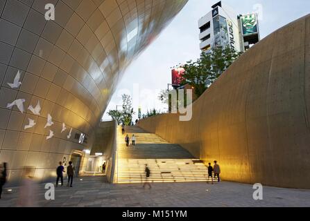 South Korea, Seoul, people walking in the middle of the Dongdaemun Design Plaza, futuristic building of the architect Zaha Hadid Stock Photo