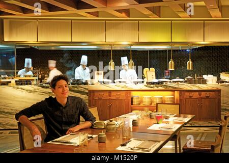 South Korea, Seoul, Fabien Yoon, the french star of the corean medias, sitting in the Market kitchen, the restaurant of the Four Seasons hotel Stock Photo