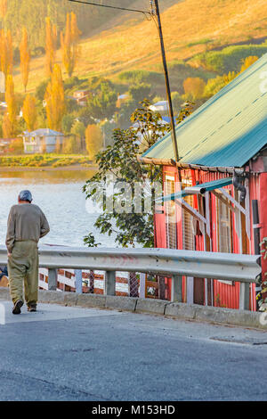 Street scene of back view of elderly man with walking stick and ...