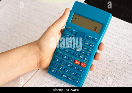 Scientific Calculator in the Action Hands During Mathematical Lesson.  School Concept Stock Photo - Alamy