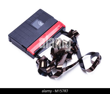 Video Cassette Tape for Home Movie Camera Unwound and  Broken Isolated on a White Background. Stock Photo
