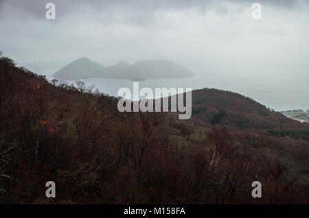 Panoramic views over Lake Toya from Mount. Usu Ropeway. The ropeway opened in 1965, and climbs Mount Usu, the active volcano in Shikotsu-Toya. Stock Photo