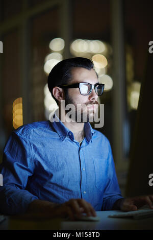 Man working late Stock Photo