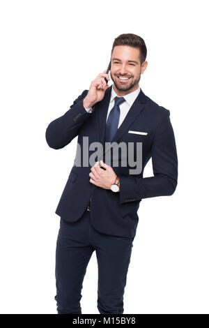 Happy young stylish businessman calling by phone, isolated on white background Stock Photo