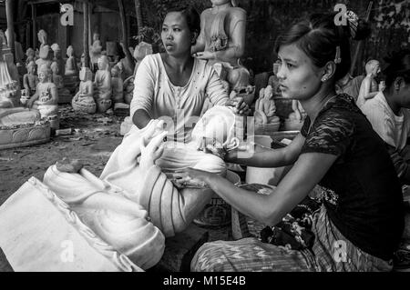 MANDALAY, MYANMAR - NOVEMBER, 2016: People involved in manual work are very common in the streets of Myanmar. Stock Photo