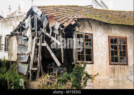 dilapidated house falling down in Alcobaca, Portugal. Stock Photo