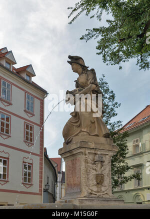 Woman with a vase or Nymph fountain in Frantiskanske namestie, Old Town. Bratislava, Slovakia. Stock Photo