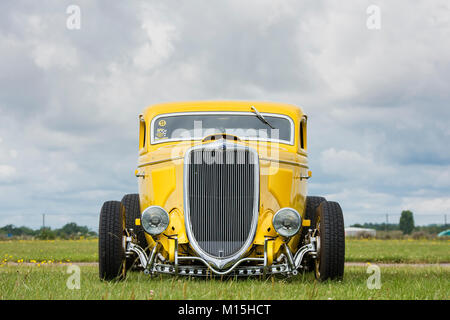 1934 Yellow Ford street rod coupe at an american car show, Essex, England. Classic vintage American car Stock Photo