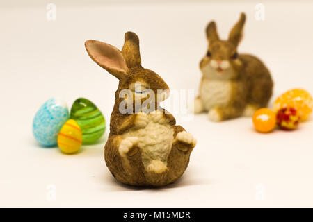 Easter bunnies with glass eggs Stock Photo