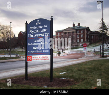 Syracuse, New York, USA. January 27, 2018. Welcoming sign to the Syracuse University campus on Crouse Drive with Maxwell Hall in the distance Stock Photo