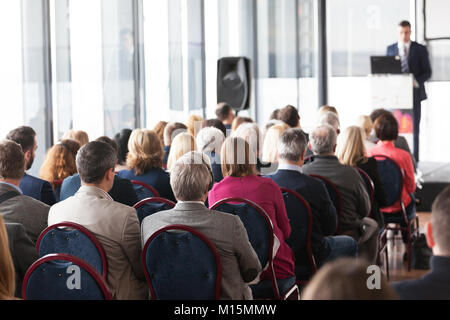 Participants of a business conference or other professional meeting listening to a presentation Stock Photo