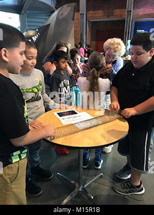 Students from Gomes Elementary School in New Bedford, Mass., learn about waves and how sound travels during the opening of a Navy exhibit sponsored by Naval Undersea Warfare Center Division Newport at the New Bedford Whaling Museum in September 2017. Science, technology, engineering and mathematics (STEM) is one of the core educational outreach programs for which NUWC Newport was honored with a Personal Excellence Partnership Flagship Award. Stock Photo