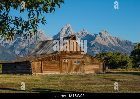 One of the Mormon Row barns with the Teton Mountains in the background.  Moose, Wyoming USA Stock Photo