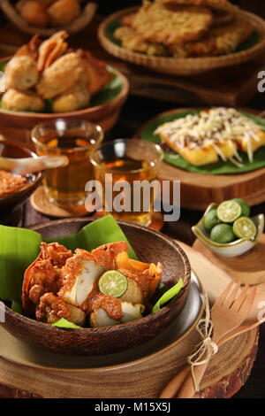 Batagor, the Sundanese Snack of Fried Fish Dumplings, Bean Curd, and Wonton with Spicy Peanut Sauce Stock Photo