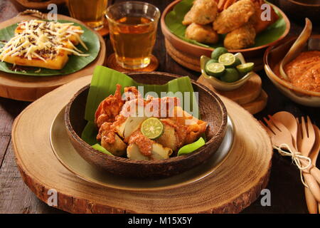 Batagor, the Sundanese Snack of Fried Fish Dumplings, Bean Curd, and Wonton with Spicy Peanut Sauce Stock Photo