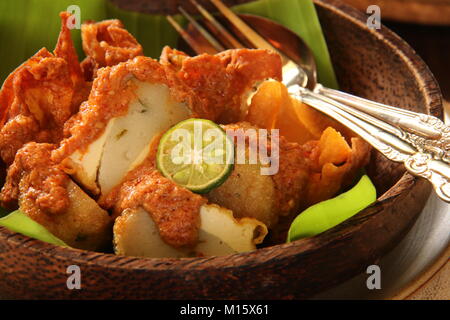 Batagor, the Sundanese Snack of Fried Fish Dumplings, Bean Curd, and Wonton with Spicy Peanut Sauce Stock Photo