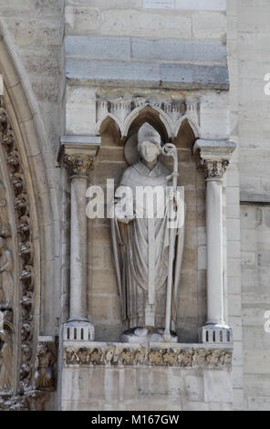 Statue 4th from the left by an entrance on the Western facade of the Notre Dame Cathedral, Paris, France. Stock Photo