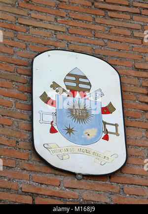 The Coat of arms of Pope Francis on one of the walls of the Basilica di Santa Maria degli Angeli e dei Martiri church, Rome, Italy. Stock Photo