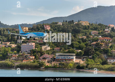 CORFU, GREECE - May 13, 2016: Aircraft Boeing 737-800 approaching Corfu International Airport. Corfu island, Greece. Stock Photo