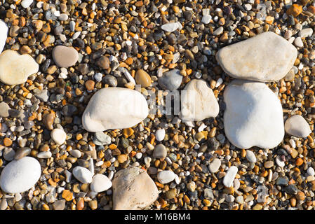 Pebbles and shingle on a beach along the Jurassic coast near Lulworth, Wareham, Dorset, UK Stock Photo