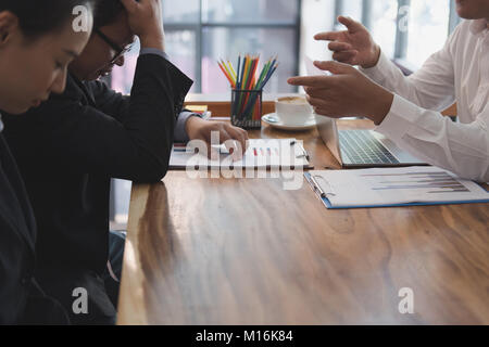 furious boss scolding frustrated woman at office. irritated man blames upset intern for failure at workplace. stressful work Stock Photo